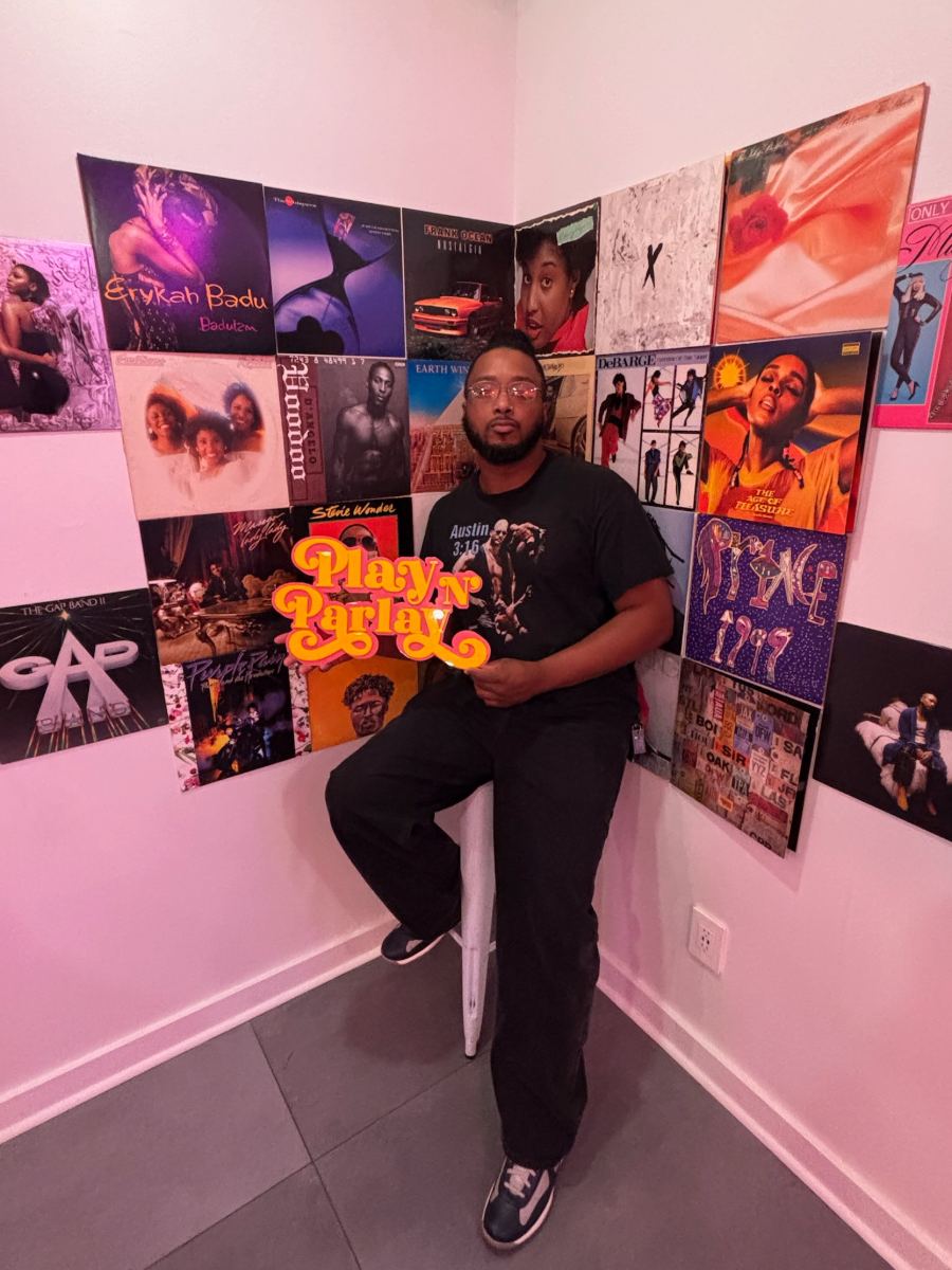 Vic in front of a wall of records